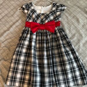 A black and white plaid pattern girl's dress.
